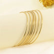 Bracelets ANJALI – Semainier de 7 joncs dorés
