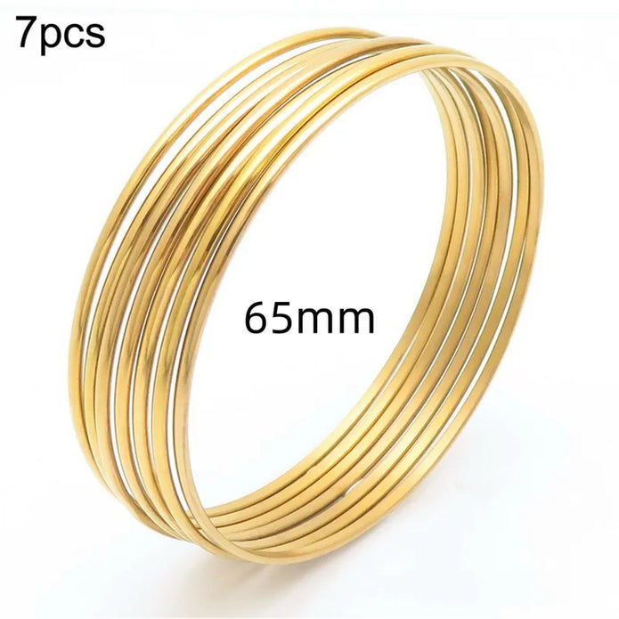 Bracelets ANJALI – Semainier de 7 joncs dorés