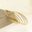 Bracelets ANJALI – Semainier de 7 joncs dorés
